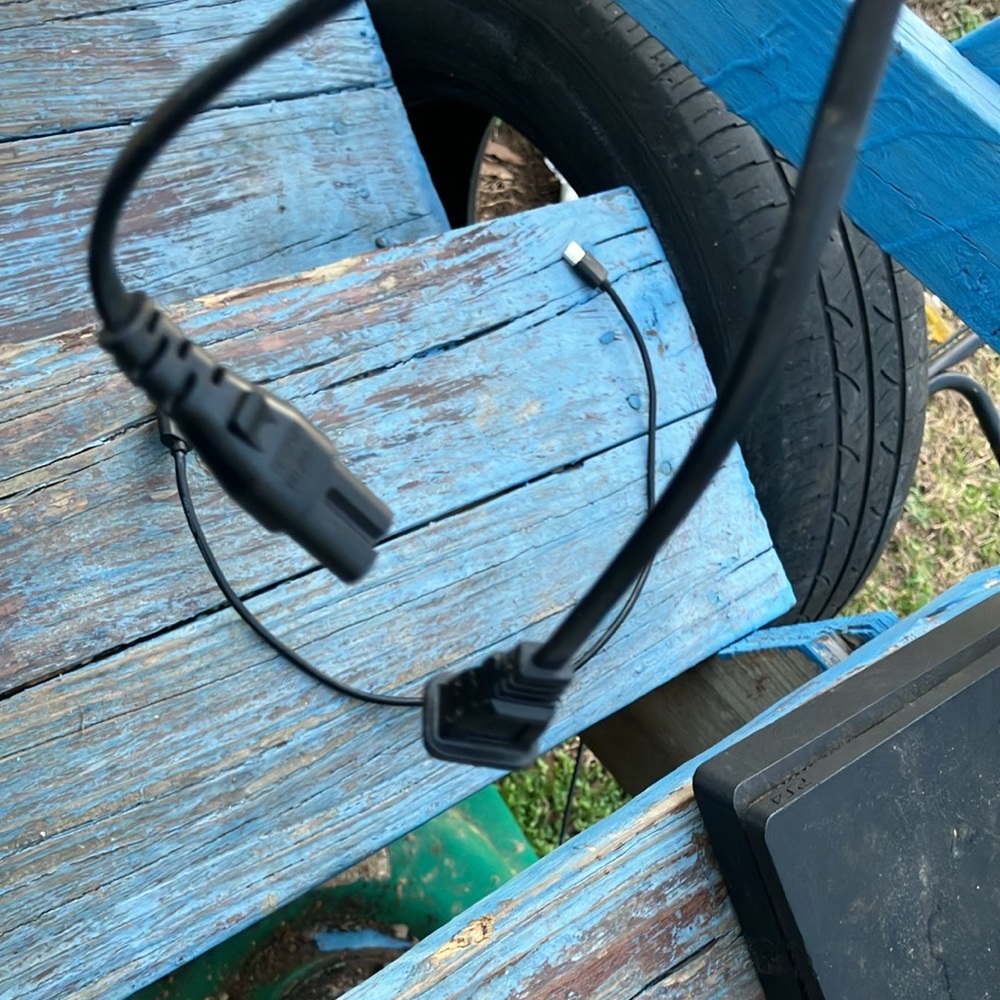 PS4 with plugs no controller and a variety games